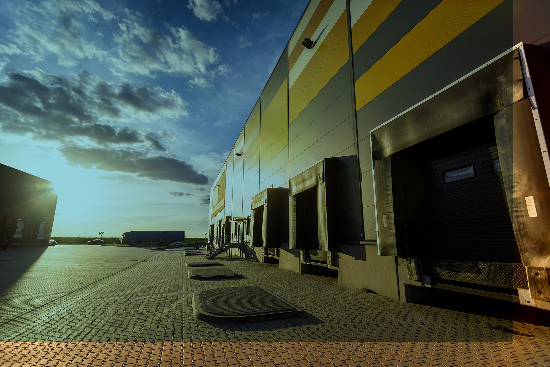 cargo-loading-dock-doors-of-big-warehouse-building-8rfzsze-3-