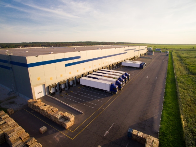 distribution-warehouse-with-trucks-different-capacity_87743-240