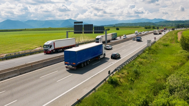 car-trucks-rushing-multiple-lane-highway-turin-bypass-italy_107467-361